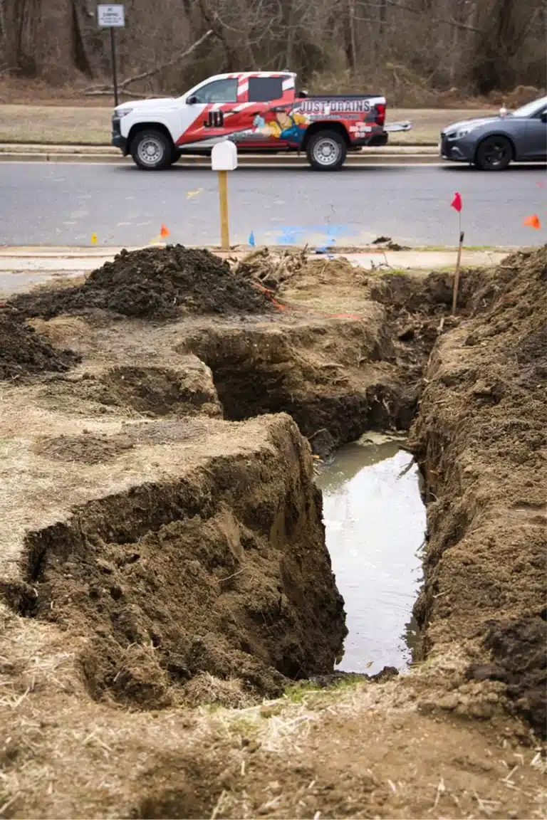 Just Drains technician clearing a drain line inside a New Jersey home