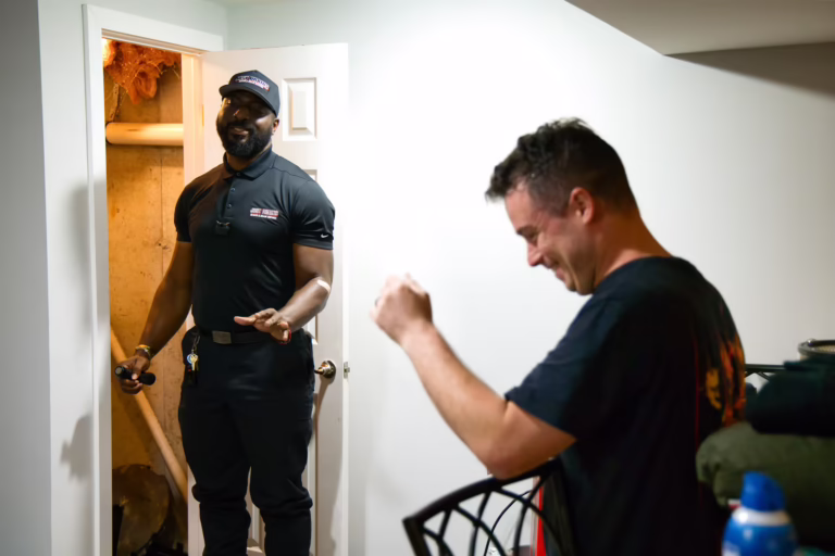 Drain technician reviewing findings with homeowner