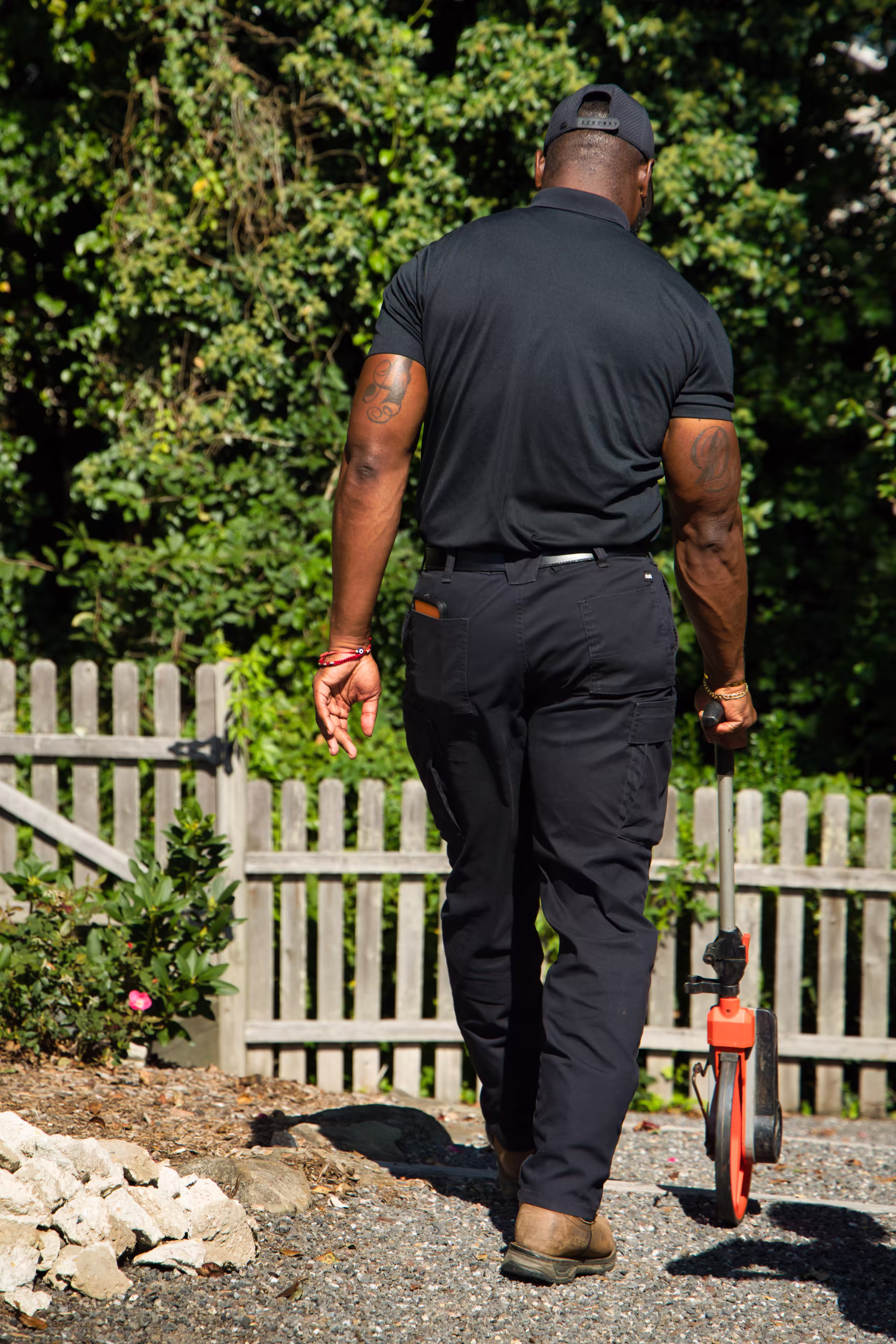 Technician carrying sewer camera inspection reel